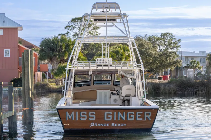 Slide: The Image of Island Hopper 30 boat "Miss Ginger" docked at Orange Beach, 2000 model. - 17