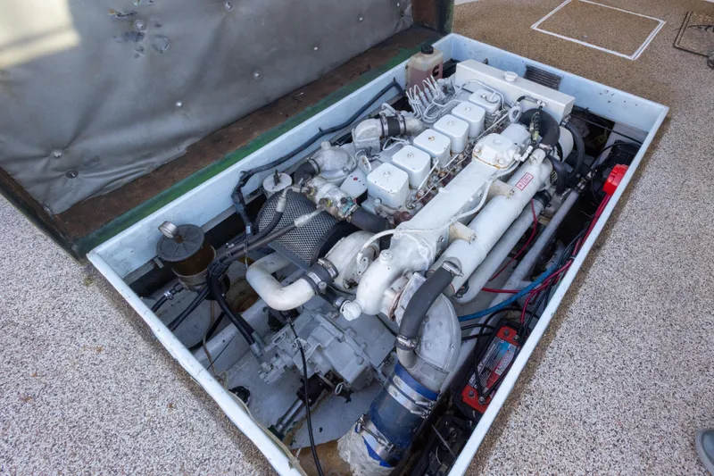 Slide: The Image of Engine compartment of a 2000 Island Hopper 30 boat, showcasing mechanical components. - 29