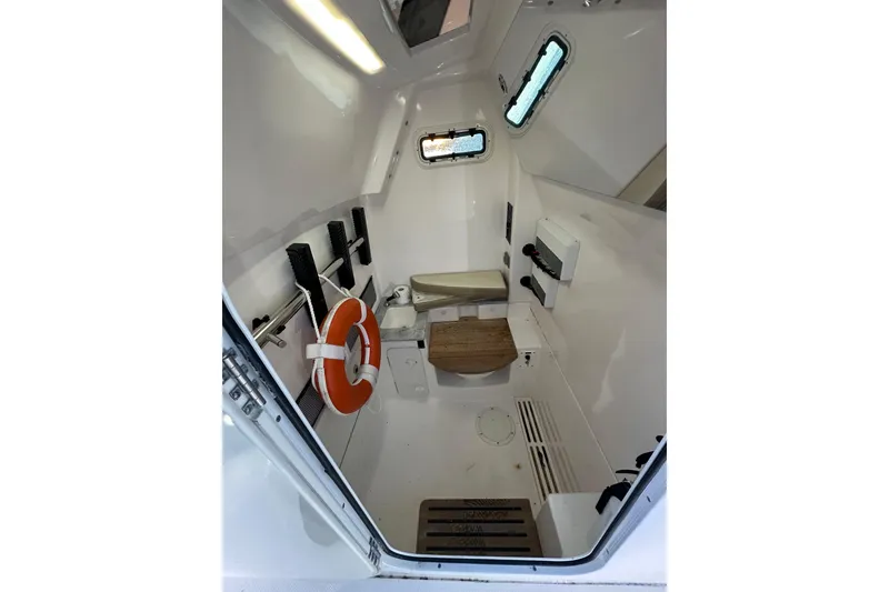 Slide: The Image of Interior of 2020 Everglades 335 Center Console boat with life preserver and seating. - 13