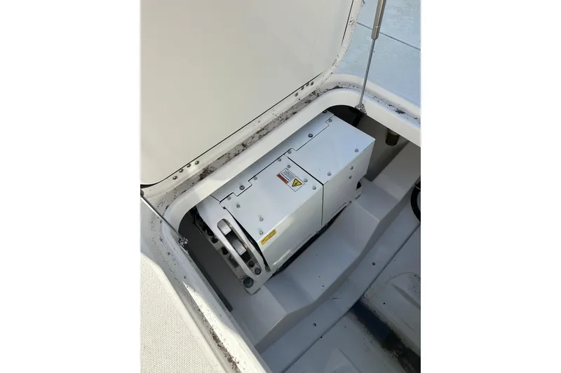 Slide: The Image of 2020 Everglades 335 Center Console boat compartment with equipment. - 16