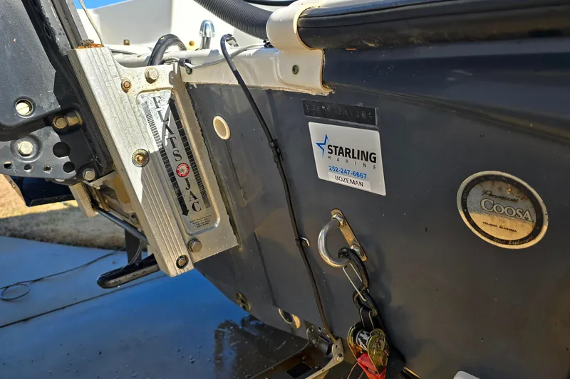 Slide: The Image of 2004 Triton 240 LTS boat with Flats Jac and Starling Marine details. - 12