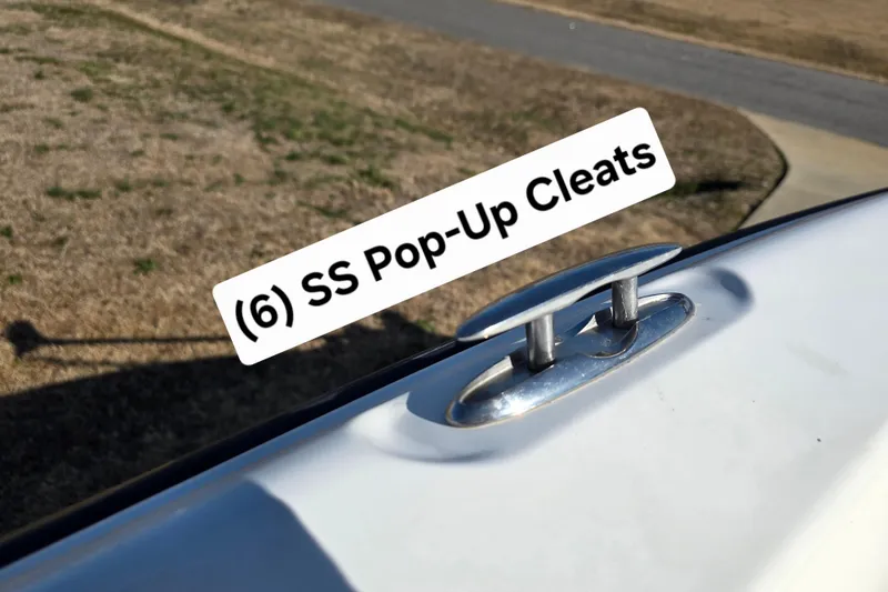 Slide: The Image of 2004 Triton 240 LTS boat with stainless steel pop-up cleats. - 16