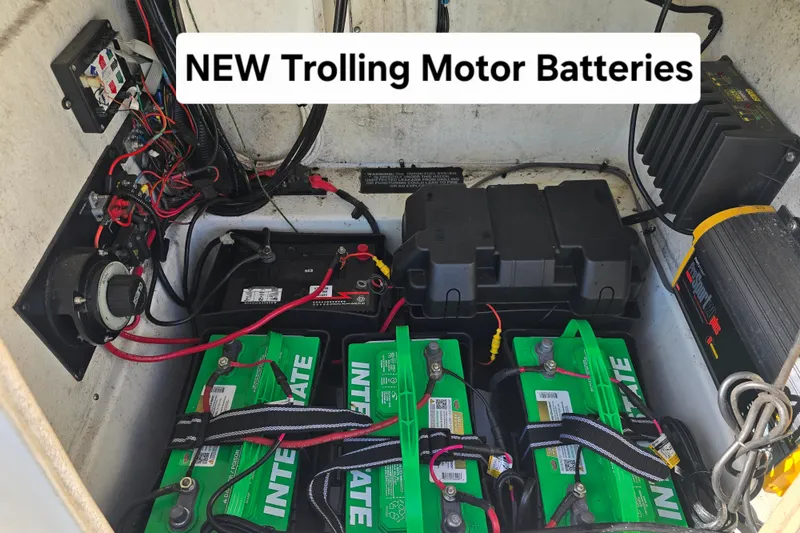 Slide: The Image of Triton 240 LTS 2004 boat with new trolling motor batteries installed. - 17