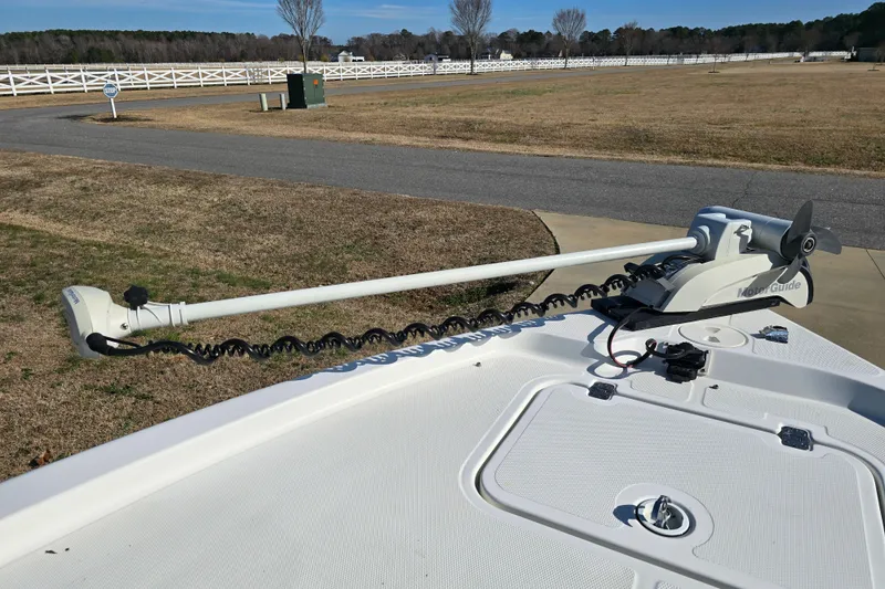 Slide: The Image of 2004 Triton 240 LTS boat with a MotorGuide trolling motor on deck. - 19