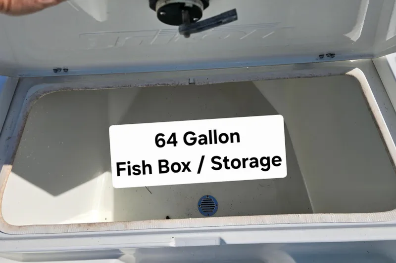 Slide: The Image of 64-gallon fish box storage in 2004 Triton 240 LTS boat. - 25