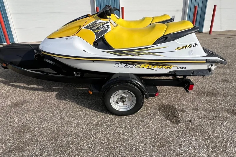 Slide: The Image of 1998 Yamaha GP760 WaveRunner on trailer, featuring yellow and white design. - 4