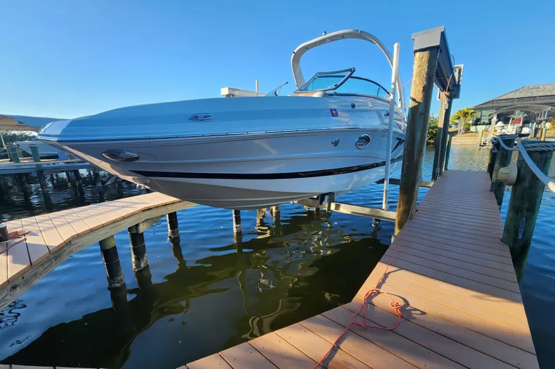Slide: The Image of 2020 Crownline Eclipse E255 XS boat docked on a sunny day. - 7