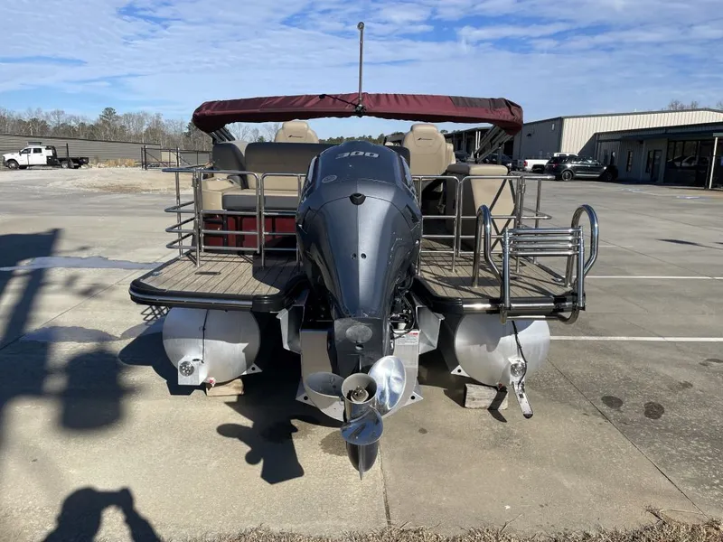 Slide: The Image of 2024 Starcraft SLS 3 Q DH pontoon boat on parking lot. - 4