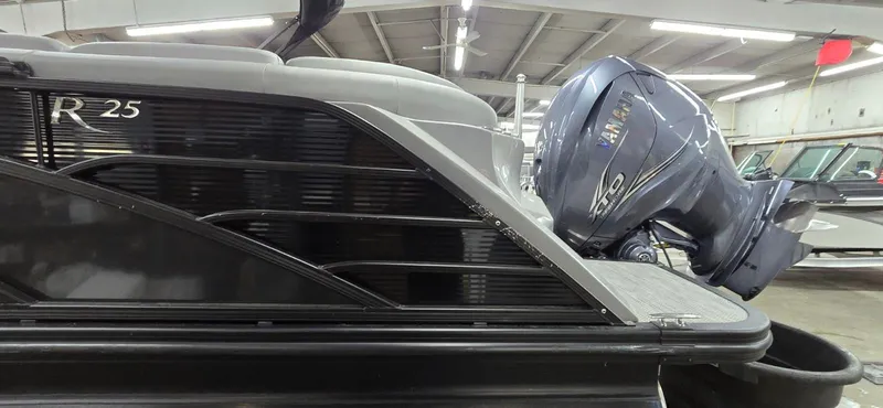 Slide: The Image of Bennington 25RFB 2022 with Yamaha engine in a storage facility. - 10