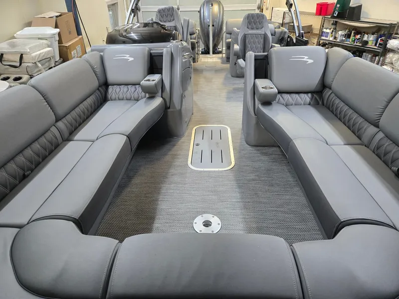 Slide: The Image of Interior of a 2022 Bennington 25RFB pontoon boat with gray upholstery. - 16