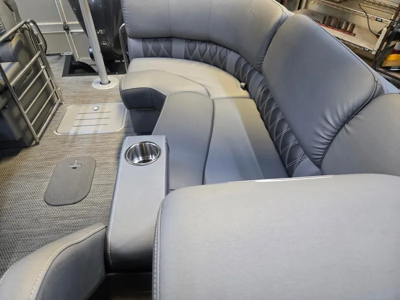 Slide: The Image of Interior of a 2022 Bennington 25RFB with gray upholstered seating. - 23