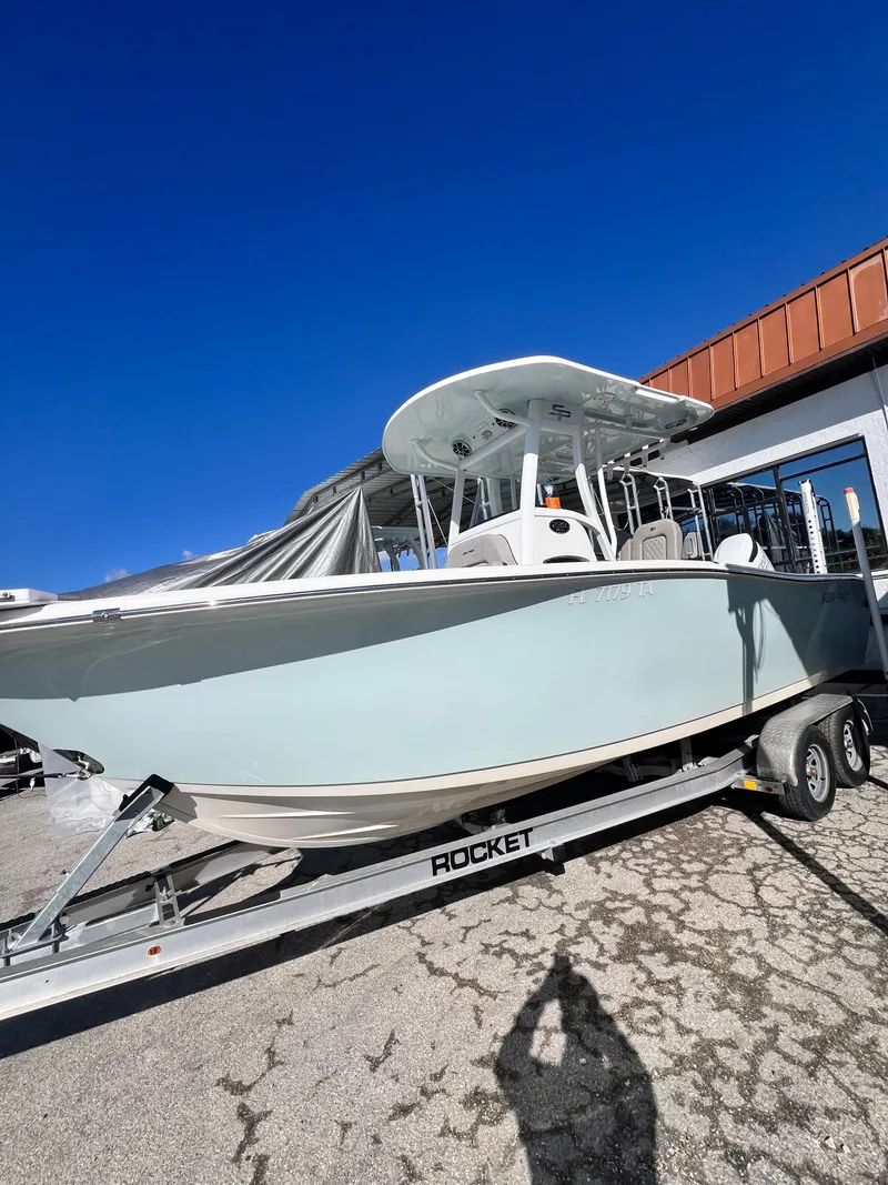 The Image of 2021 Sea Pro 239 DLX boat on trailer under sunny skies. - 1