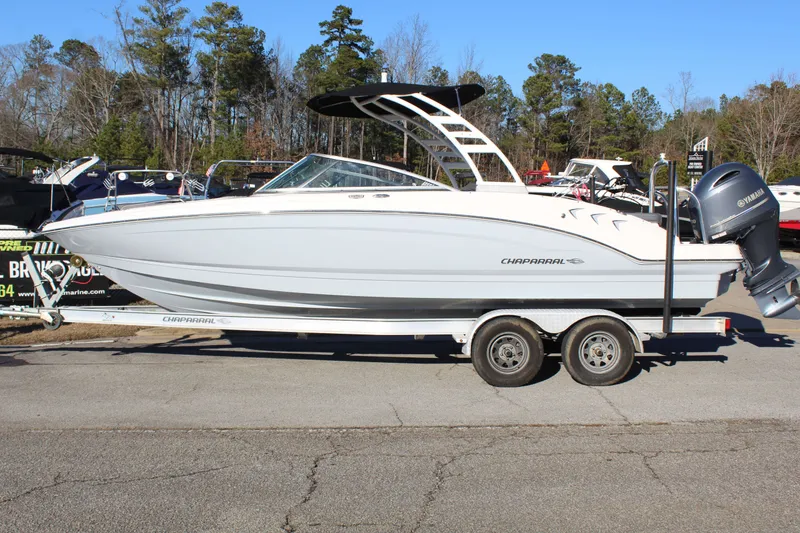 The Image of 2021 Chaparral 23 SSi O/B boat on trailer outdoors. - 1