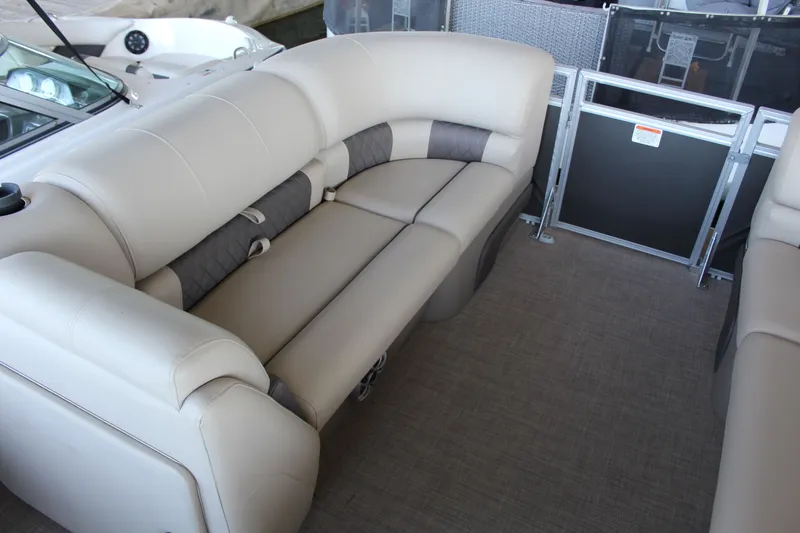 Slide: The Image of Interior of Tracker PB 20 DLX 2025 with beige leather seating. - 13