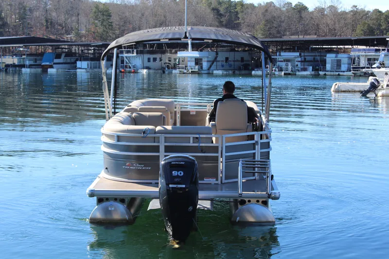 Slide: The Image of Tracker PB 20 DLX pontoon boat 2025 on calm water. - 5