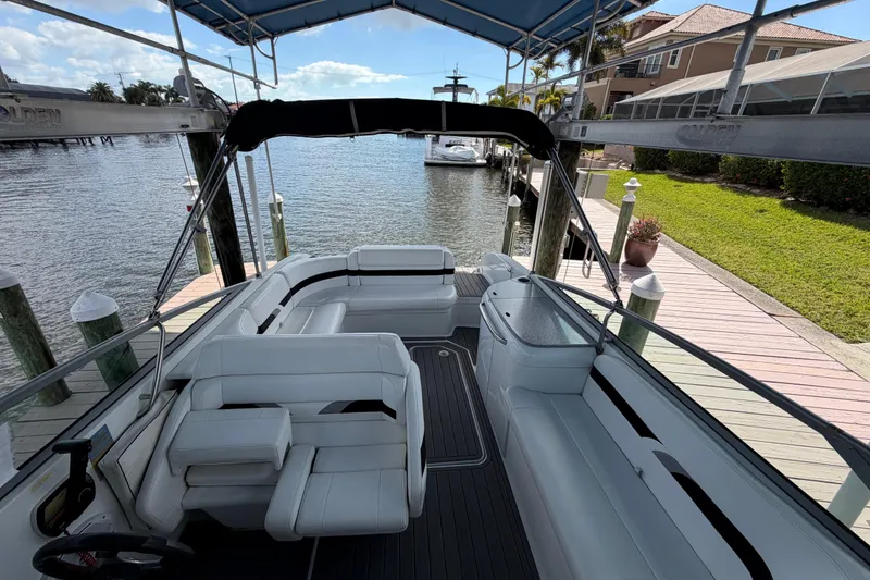 Slide: The Image of 2004 Formula 260 Bowrider docked, featuring spacious seating and sleek design. - 14