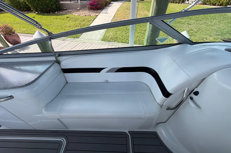 Slide: The Image of 2004 Formula 260 Bowrider interior with white seating and sleek design. - 17