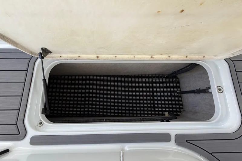 Slide: The Image of Open storage compartment on a 2004 Formula 260 Bowrider boat. - 30