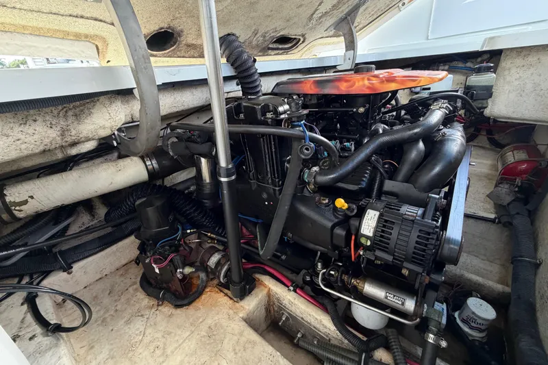 Slide: The Image of Engine compartment of a 2004 Formula 260 Bowrider boat, showcasing detailed mechanical components. - 38