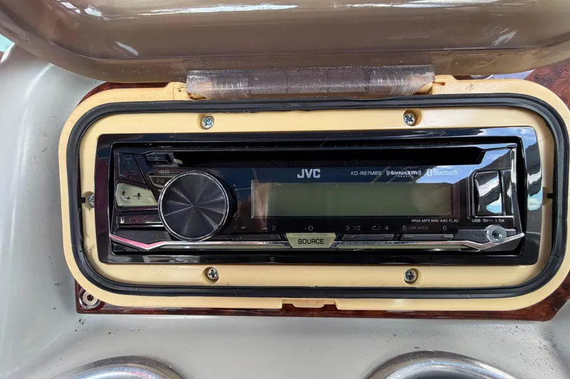 Slide: The Image of JVC stereo system in a 2004 Formula 260 Bowrider boat dashboard. - 41
