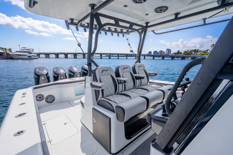 Slide: The Image of 2024 Yellowfin 39 Offshore boat interior with luxurious seating and multiple outboard engines. - 18
