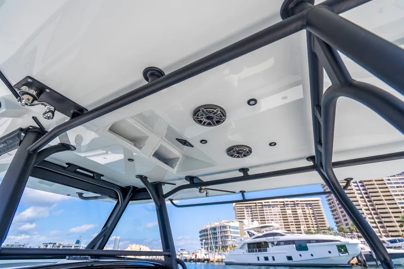 Slide: The Image of 2024 Yellowfin 39 Offshore boat with sleek T-top and marina view. - 19