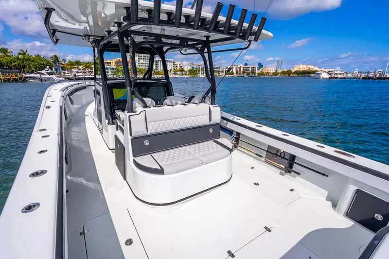 Slide: The Image of 2024 Yellowfin 39 Offshore boat on water, featuring sleek design and spacious seating. - 20