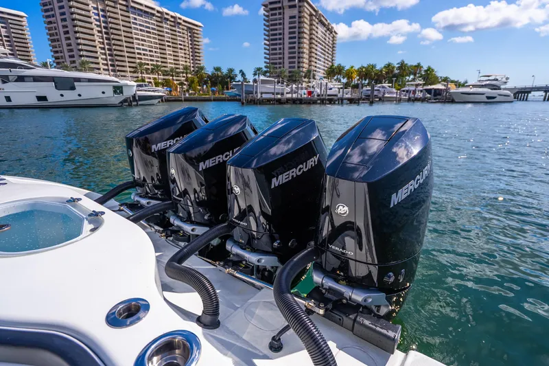 Slide: The Image of 2024 Yellowfin 39 Offshore with four Mercury outboard engines docked in a marina. - 24