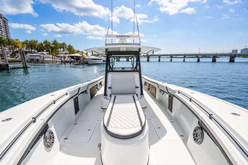 Slide: The Image of 2024 Yellowfin 39 Offshore boat on water, featuring sleek design and spacious deck. - 26
