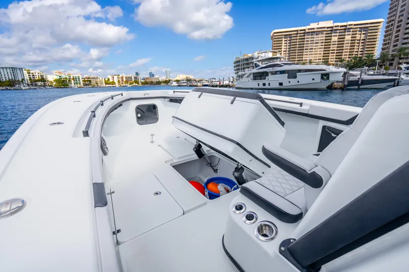 Slide: The Image of 2024 Yellowfin 39 Offshore boat interior with open storage, docked in marina. - 27