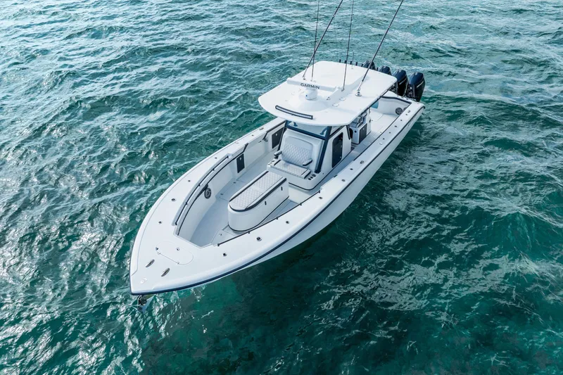 Slide: The Image of 2024 Yellowfin 39 Offshore boat on clear blue ocean waters. - 3