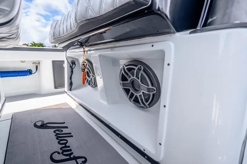 Slide: The Image of 2024 Yellowfin 39 Offshore boat interior with speakers and seating detail. - 31