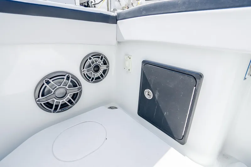 Slide: The Image of 2024 Yellowfin 39 Offshore boat interior with speakers and storage compartment. - 32