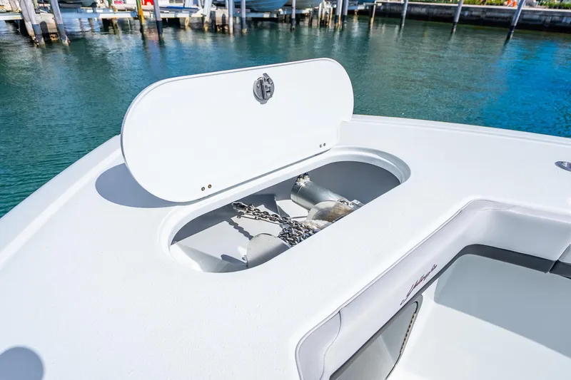 Slide: The Image of 2024 Yellowfin 39 Offshore boat anchor compartment open at dock. - 33