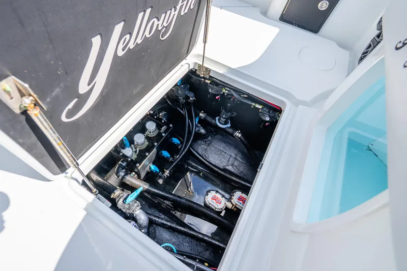 Slide: The Image of 2024 Yellowfin 39 Offshore boat engine compartment with visible components and wiring. - 34