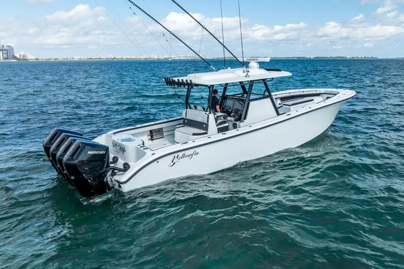 Slide: The Image of 2024 Yellowfin 39 Offshore boat on open water, featuring multiple outboard engines. - 4