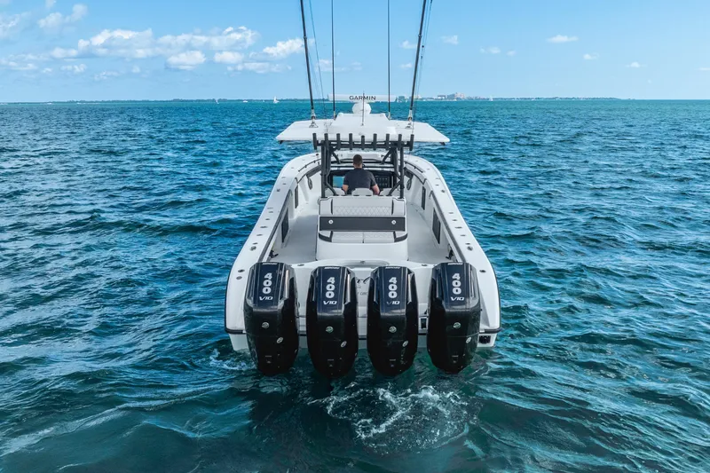 Slide: The Image of 2024 Yellowfin 39 Offshore boat with four powerful engines cruising on open water. - 5