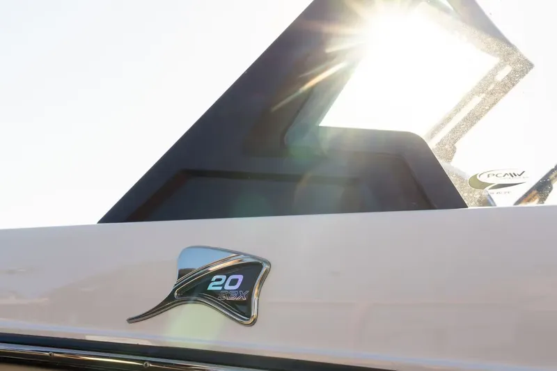 Slide: The Image of Stingray 20 SBX 2026 boat with sunlight in background. - 8