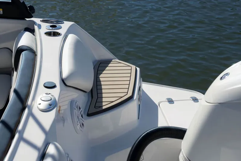 Slide: The Image of 2026 Stingray 20 SBX boat, deck detail by the water. - 10