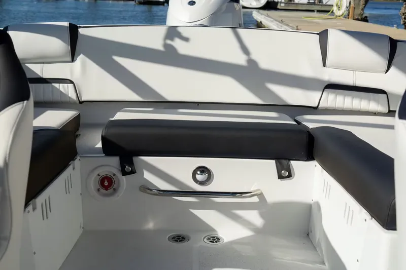 Slide: The Image of Interior of 2026 Stingray 20 SBX boat with black and white seating. - 11