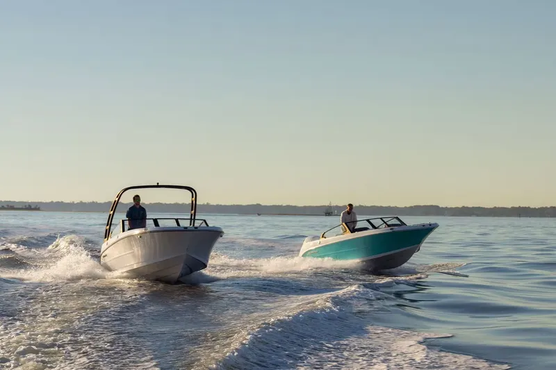 Slide: The Image of Two boats on water at sunset, Stingray 20 SBX 2026. - 2