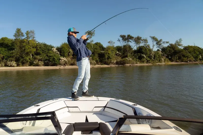 Slide: The Image of Angler on Stingray 20 SBX boat fishing, 2026 model. - 5