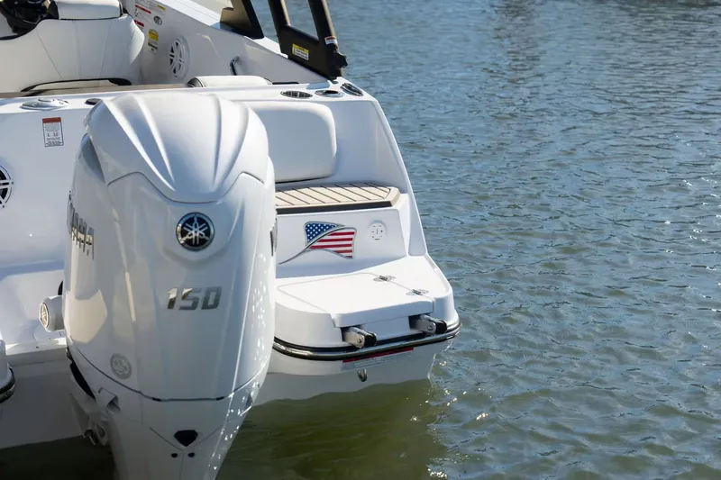 Slide: The Image of Stingray 20 SBX 2026 boat with Yamaha 150 engine on water. - 8
