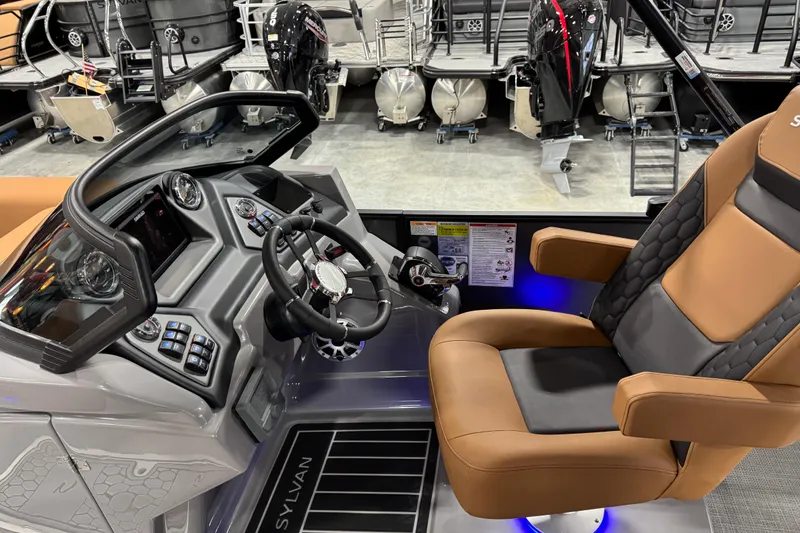 Slide: The Image of Interior of 2026 Sylvan L-5 boat with modern dashboard and comfortable seating. - 15
