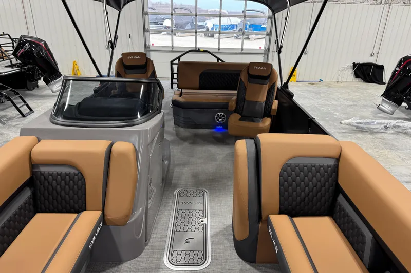 Slide: The Image of 2026 Sylvan L-5 boat interior with tan and black seating, modern design. - 7
