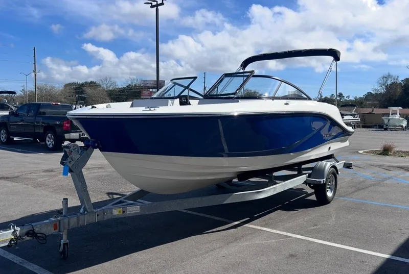 Slide: The Image of 2026 Bayliner V20 boat parked on a trailer outdoors. - 7