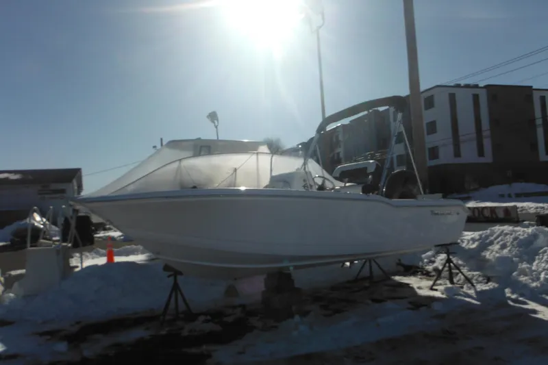 The Image of 2026 Tidewater 180 CC Adventure boat on stands in snowy outdoor setting. - 0