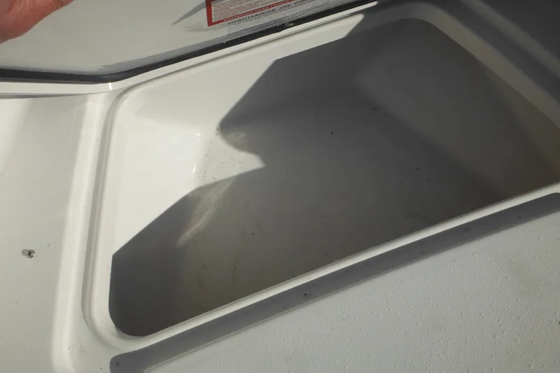 Slide: The Image of Storage compartment of 2026 Tidewater 180 CC Adventure boat, open and empty. - 18