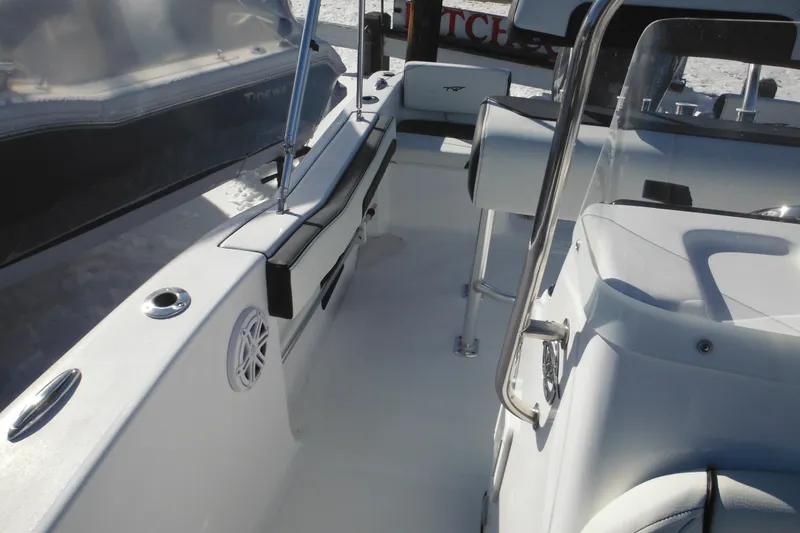 Slide: The Image of 2026 Tidewater 180 CC Adventure boat interior with seating and console. - 21