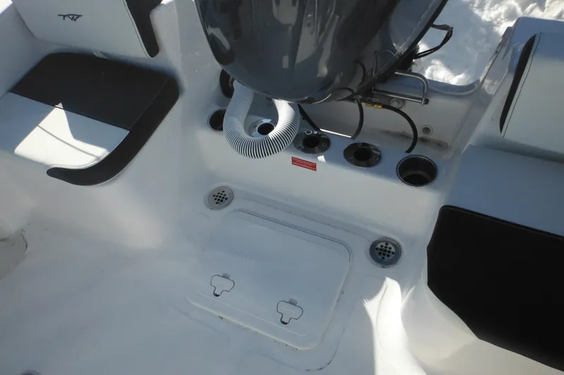 Slide: The Image of Interior view of 2026 Tidewater 180 CC Adventure boat, showcasing seating and engine area. - 25
